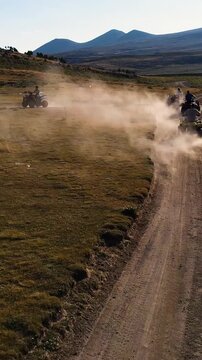 Aerial View Behind Atvs By Lake Mountain Vertical Video