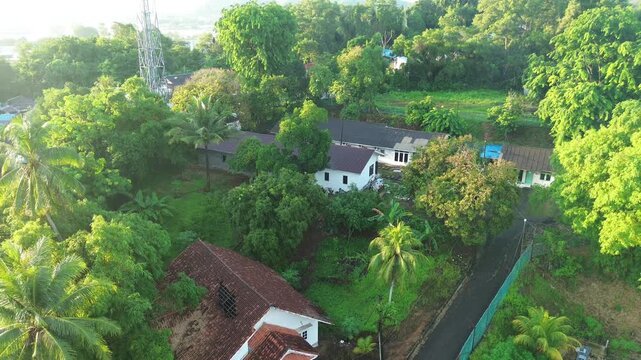 Exploring the tranquil beauty of a secluded hamlet surrounded by a rich tapestry of lush green