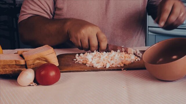 a man is cooking dinner in his kitchen