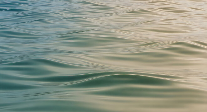 Abstract green and grey water ripples on a calm lake surface