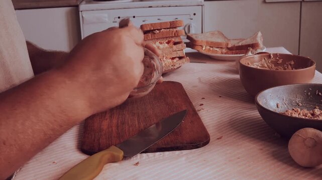 A man prepares a salad with tuna and egg