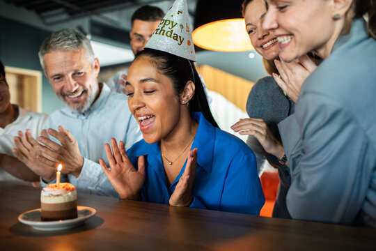 Coworkers celebrate colleague's birthday in office