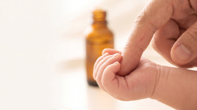 Adult Finger Gently Touching Newborn Velvety Palm &ndash; Immune Touch Macro &ndash; Building Microbiome Foundation &ndash; High‑Key Ethereal Light