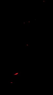 Cinematic vertical fire sparks and glowing embers overlay with transparent alpha channel for cinematic overlays, video editing, and special effects in movies or commercial projects.