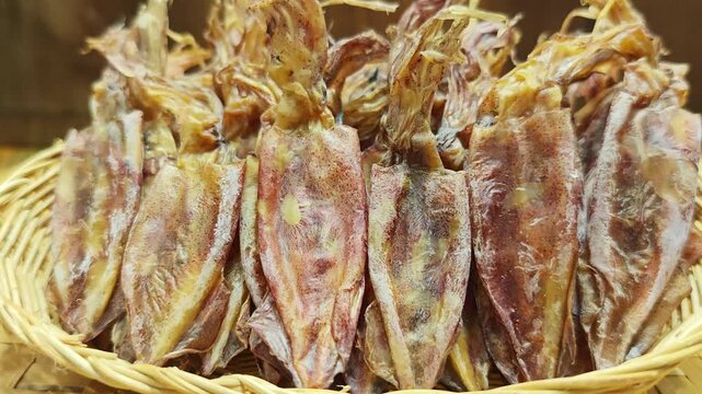 Dried squid on a basket.