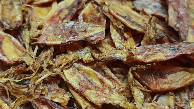 Dried squid on a basket.