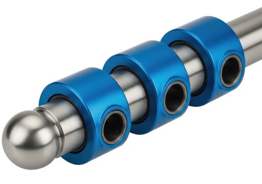 Close-up view of a metal rod with blue threaded connectors and a spherical end.