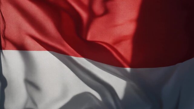 Red and White Fabric Flag Waving in Gentle Daylight Breeze