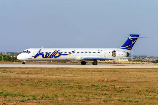 Luqa, Malta - July 16, 2005: Hello McDonnell Douglas MD-90-30 (REG: HB-JIA) backtracking on lining up runway 32 for take off.