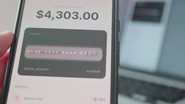 Close-up of smartphone displaying bank security alert and restricted platinum virtual account