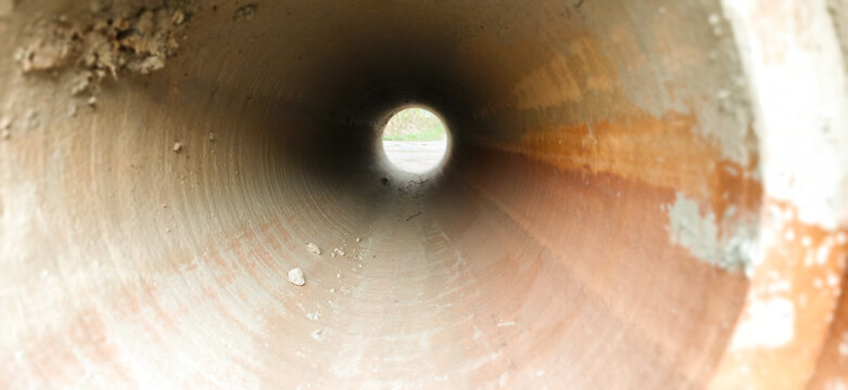 Construction of concrete pipes inside a work site during daylight hours