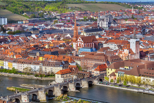 Elevated close up view of Wurzburg historical center with Old Main Bridge Germany. Scenic old town cityscape under cloudy sky