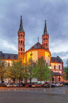 Apsidal view of Wurzburg Cathedral in Wurzburg Germany at dusk. Romanesque church facade illuminated with night lights