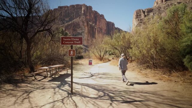 Woman walking the Santa Elena Trailhead Big Bend National Park