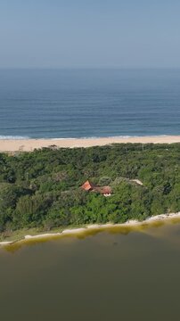 Florianopolis in Santa Catarina. Aerial view, Peri Lagoon and Caldeir&atilde;o Beach. Vertical video.