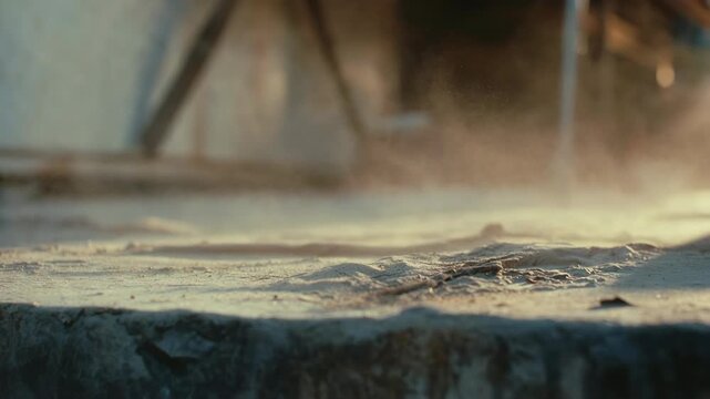Closeup of dusty ground with sunlight highlights, natural style, on blurred background, concept of texture and atmosphere