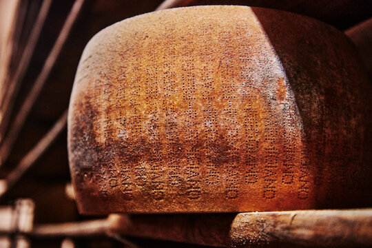 A large, aged wheel of Parmigiano Reggiano, an authentic Italian cheese, Parma, Italy, Europe