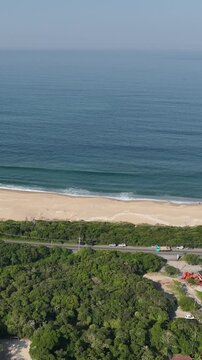 Florianopolis in Santa Catarina. Aerial view, Peri Lagoon and Caldeir&atilde;o Beach. Vertical video.