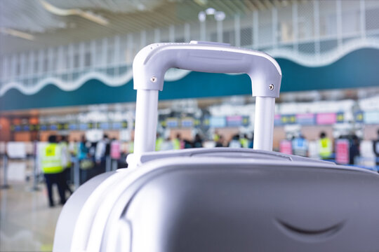travelling suitcase, travel luggage at airport terminal