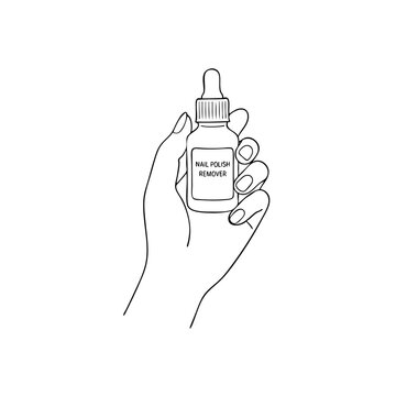 Hand holding nail polish remover bottle 