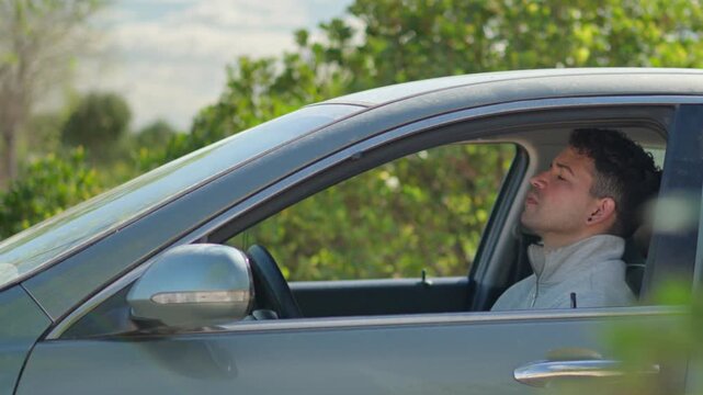 Anxious Male Driver Breathing Heavily During Panic Attack Inside Parked Car