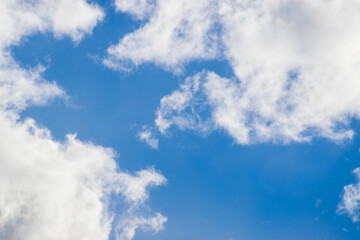 Obraz premium Beautiful blue sky with white fluffy clouds, natural daytime image, cloudscape with copy space. Scenic beauty of nature of Leh, Ladakh, India. Ladakh is known for clear atmosphere, bright environment.