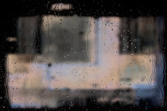 Raindrops on cold car window texture closeup