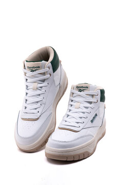 Reebok white leather high top sneakers pair isolated on white background product shot