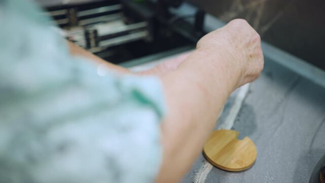 White grandmother hands stirring sugar in glass mug on marble countertop, wooden jar with lid beside, careful slow motion, warm morning light, intimate domestic ritual, retired homecook tending