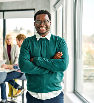 Portrait of a group of young business people having a meeting or training in the office. Teamwork and success concept, portrait of a smart young businessman, student, teacher or coach