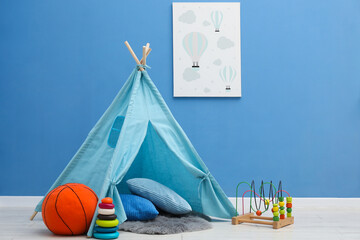 Wigwam, toys, pillows and picture in child's room © New Africa