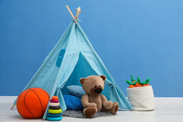 Wigwam, toys and pillows in child's room © New Africa