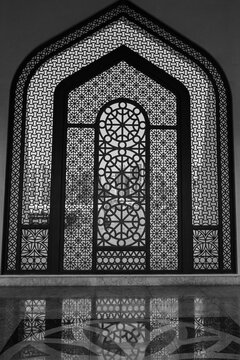 Doha, Qatar - April 19, 2025: An ornate entrance door inside the Imam Abdul Wahhab Mosque. A State of Qatar mosque in the Arabic style, Middle Eastern, Arabian Peninsula. Grand Mosque, West Bay. Verti