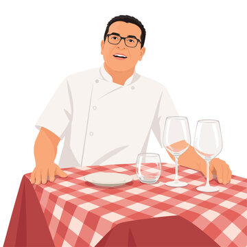 Male chef sitting at restaurant table with glasses