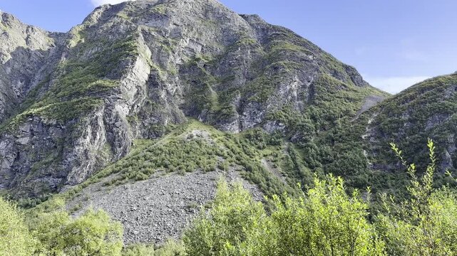 There are huge giant mountains in Norway, and a forest is located nearby
