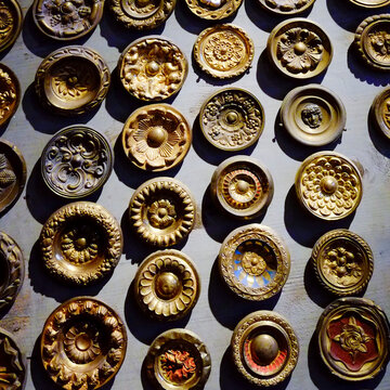 Ornate gilded rosettes and decorative ceiling medallions