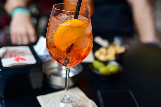 Aperol Spritz  ,olives and taralli tipical italian snack for aperitivo in a bar in , Italy
