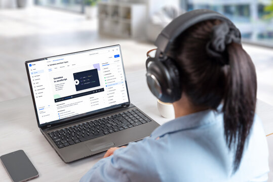 Coding course platform displayed on laptop during online study session, featuring programming lessons, developer dashboard and digital education interface