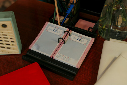 Vintage flip calendar open to May dates on a desk