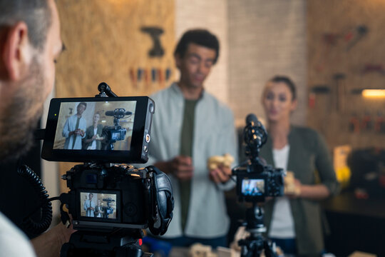 Content creators filming video with cameras for online channel
