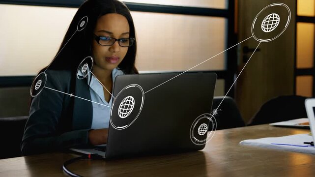 Businesswoman typing at laptop, node appearing near lid starting data nodes linking across table