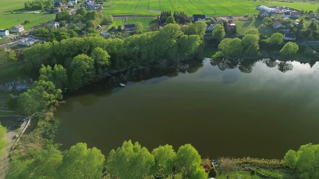 Drone Shot of Lakeside Area with Trees and Farmland &ndash; 4K ProRes