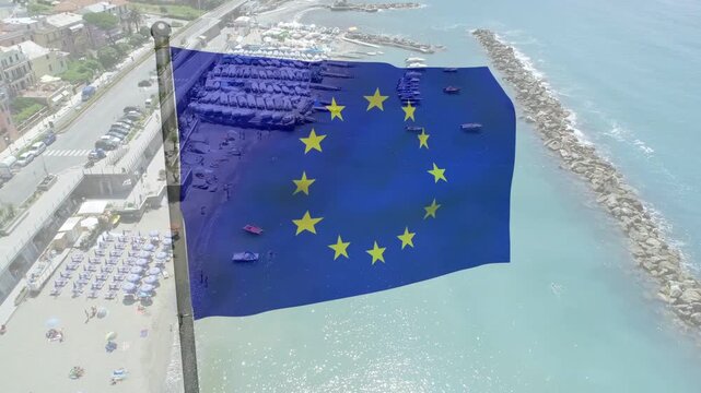 European Union flag catching gusts, rippling then settling into steady flap over shore showing wind