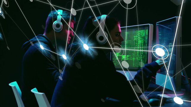 Two devs coding and pointing monitors, causing overlay to map heads and hands during code work