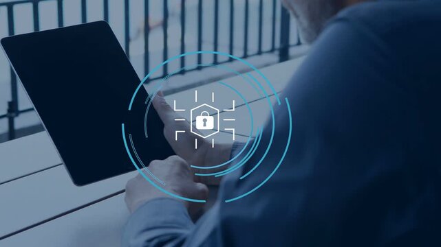 Man placing and tapping tablet on terrace, animating security HUD with lock icon, unlocking device