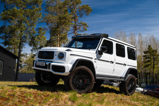 Djurhamn, Sweden - May 10, 2026: White Mercedes AMG G63 4x4 Squared Luxury SUV at car exhibition
