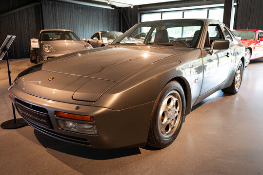 Djurhamn, Sweden - May 10, 2026: Classic Grey Porsche 944 Sports Coupe in Swedish Showroom