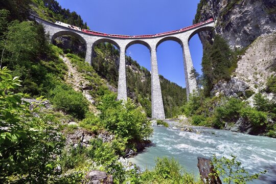 A train of the Rhaetian Railway on the Landwasser Viaduct, UNESCO World Heritage Site, near Filisur, Canton of Grisons, Switzerland