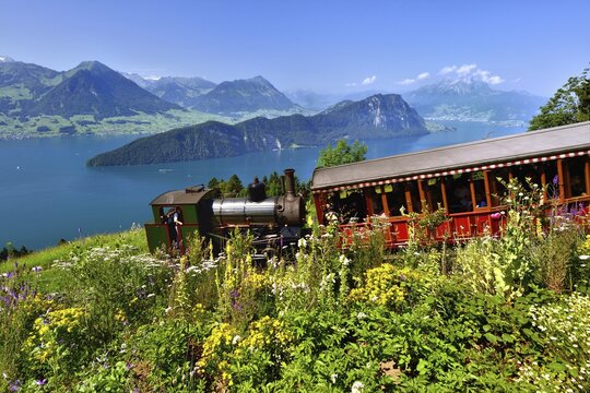 steam railway climbing Mount Rigi, Lake Lucerne,  B&uuml;rgenstock mountain and Pilatus mountain at the back, Vitznau, Canton of Lucerne, Switzerland