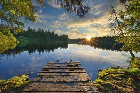 Moor lake Etang de la Gruere at sunset, reflection of the surroundings, Canton Jura, Switzerland